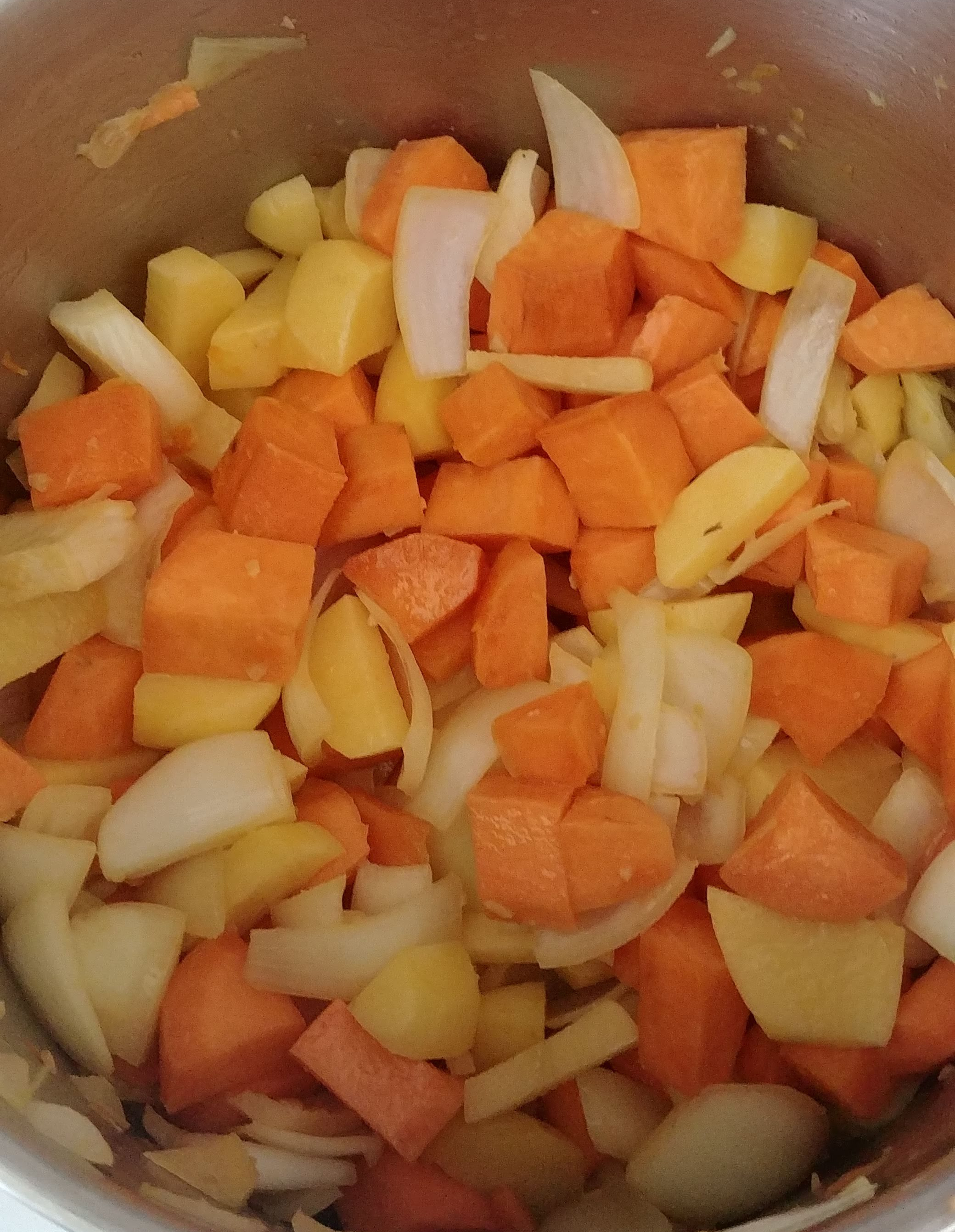 Sweet potatos, yellow potatoes, and onion