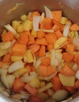 Sweet potatos, yellow potatoes, and onion